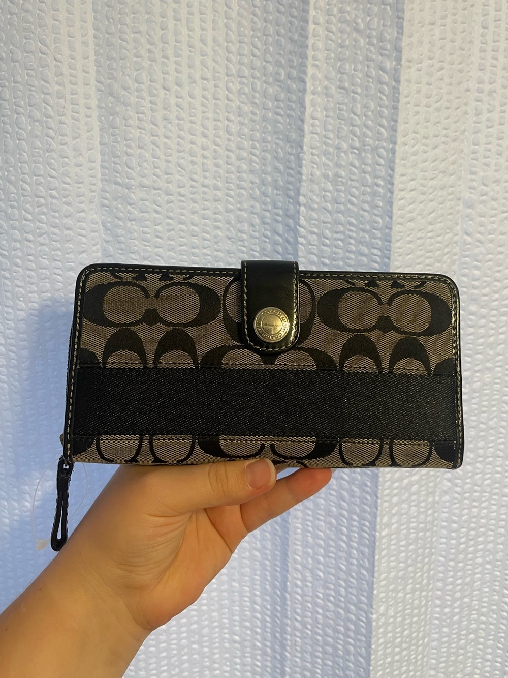 48. Coach wallet.